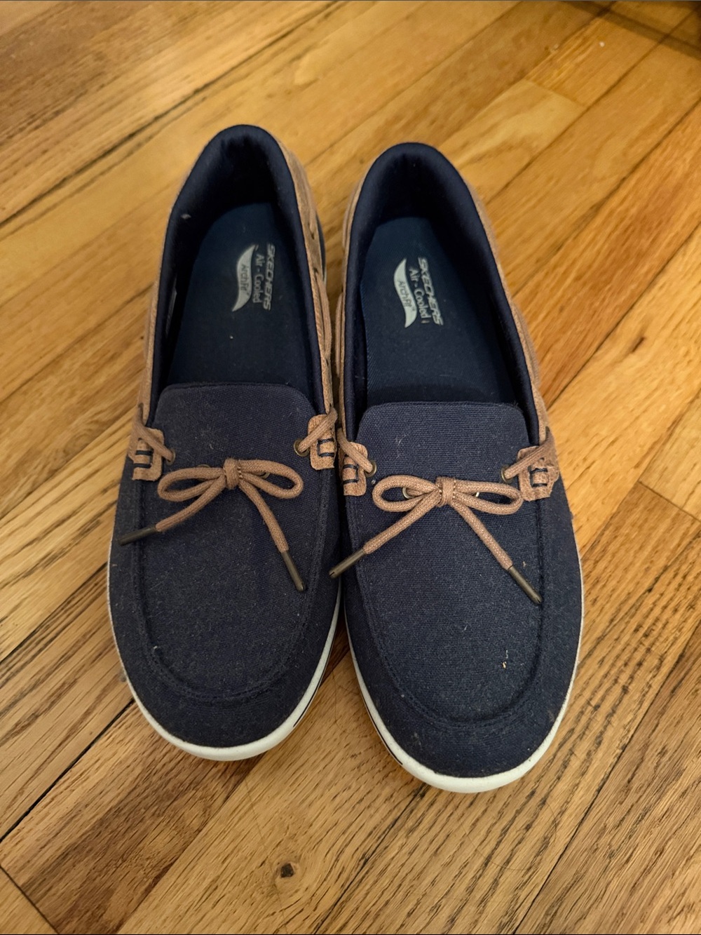 Skechers Navy Moccasin Slip-Ons with Tan Accents